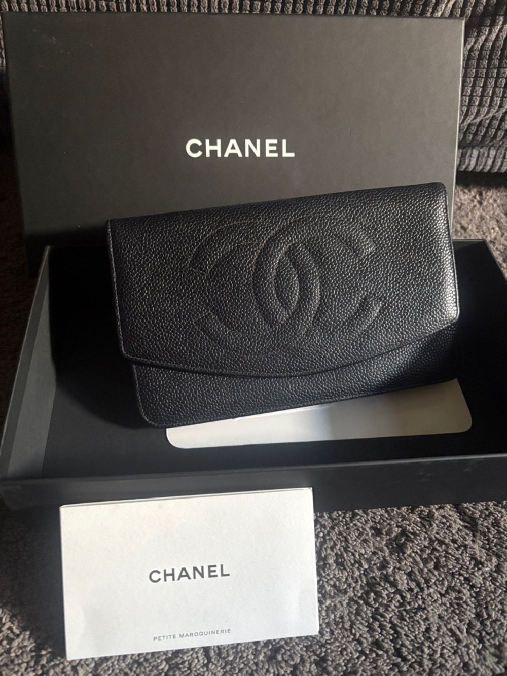 CHANEL Black Caviar Leather Clutch with Embossed CC